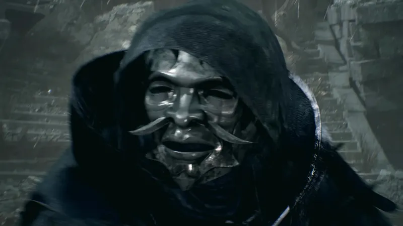 A hooded figure in a silver mask.