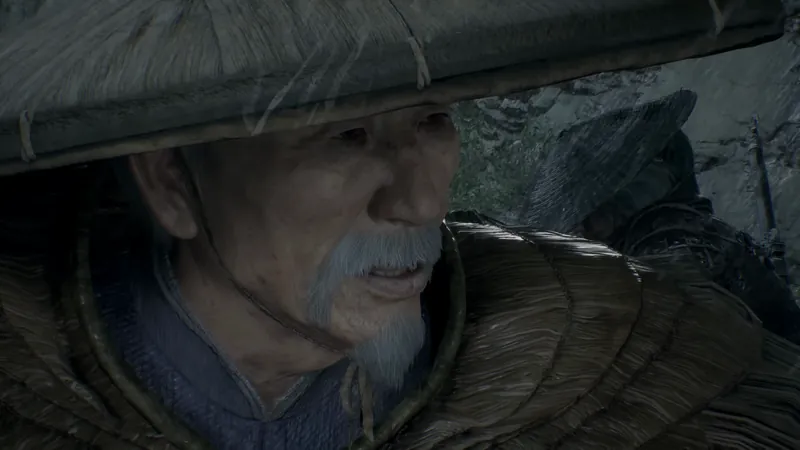 An old man under a wide straw hat.