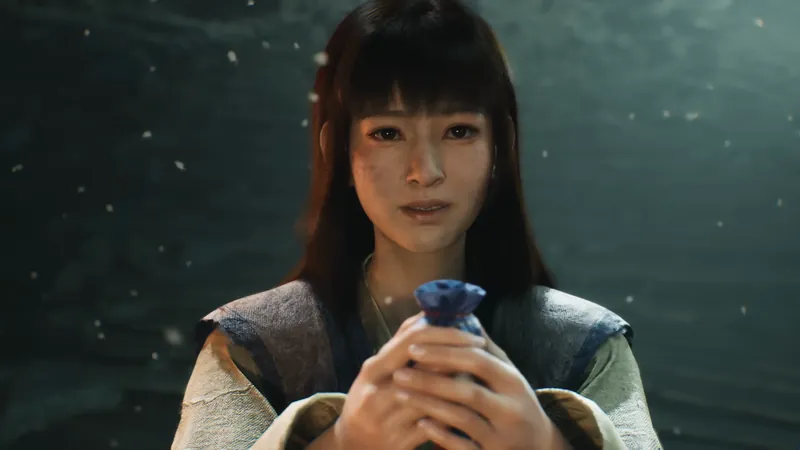 A young woman holding a blue pouch.