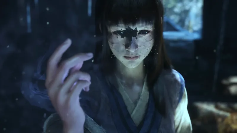 A woman's face with dark patches, in blue light.
