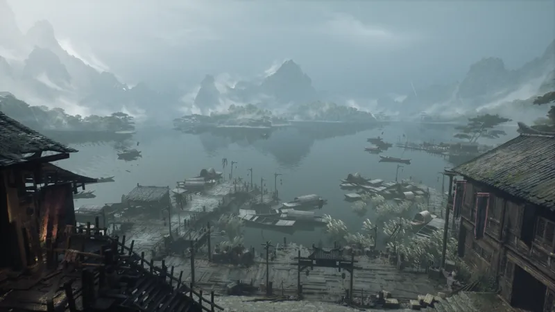 A lake among misty peaks, boats below.