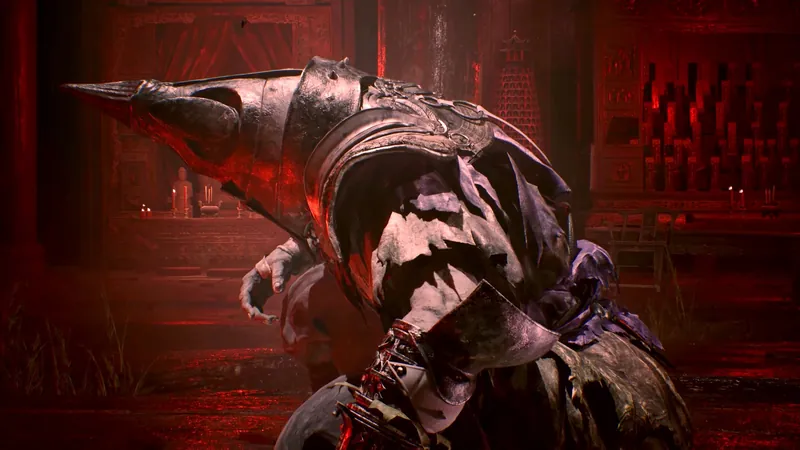A hunched figure in a pointed helmet, red light.