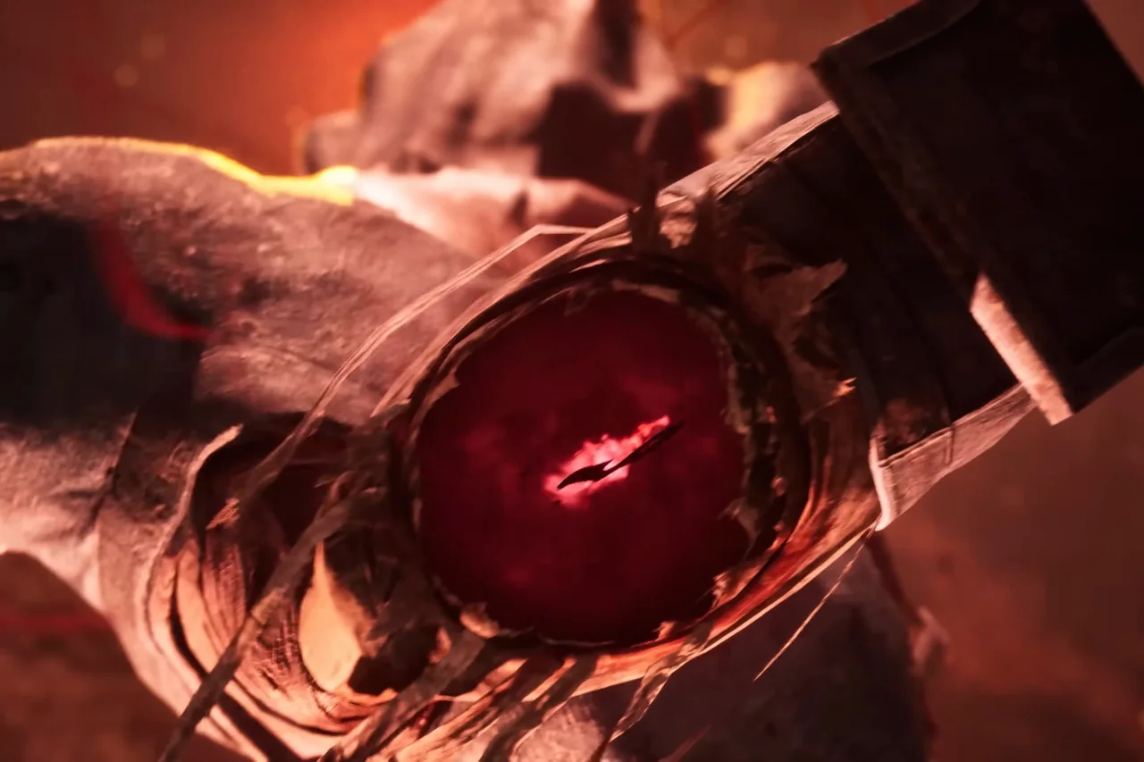 Close-up of a figure in a tall square hat hanging upside down, a red glow where its face should be.