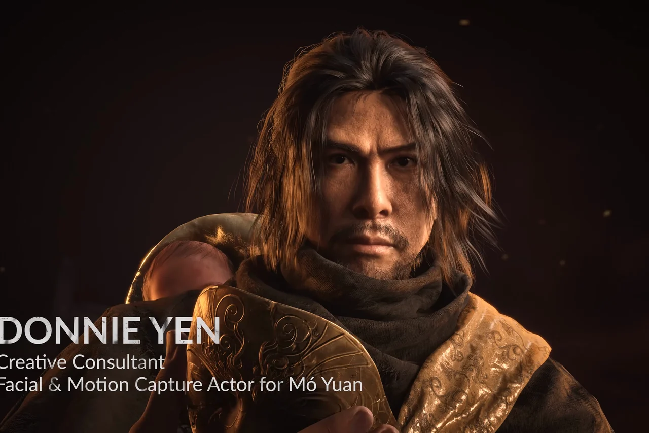 Close-up of a long-haired man beside a title card.