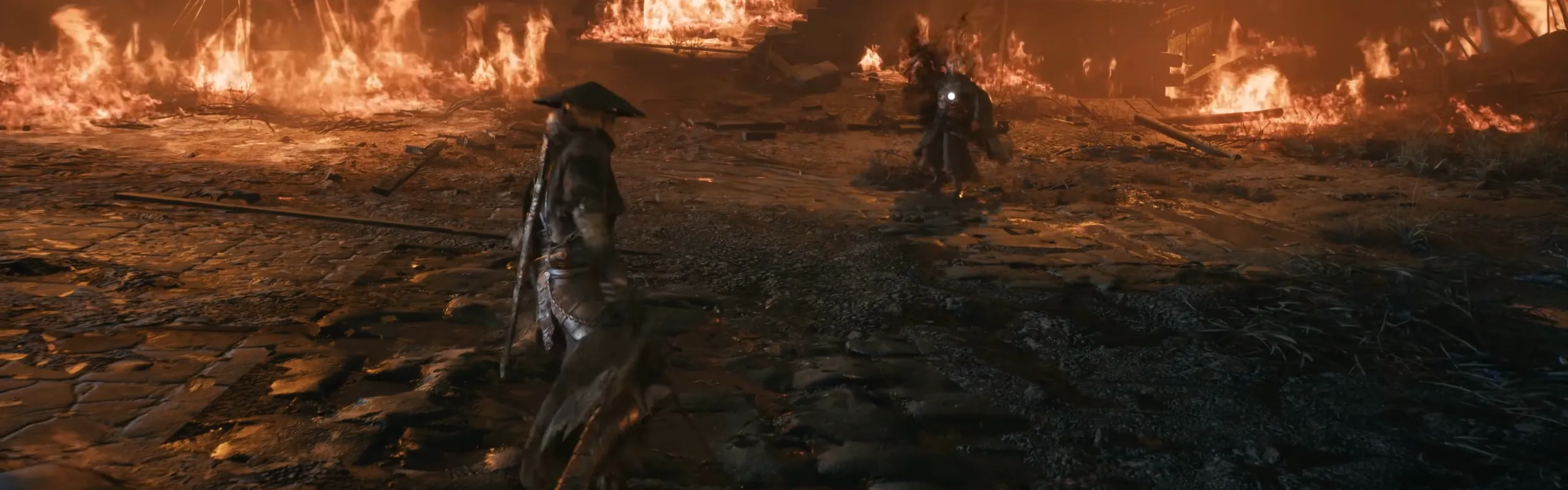 Two figures face each other across a burning stone courtyard at night.