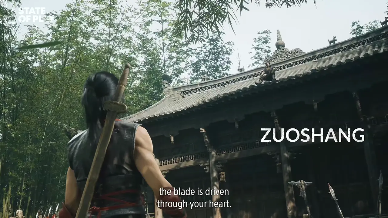 A long-haired man with a sword on his back stands before a temple hall in a bamboo grove; the name ZUOSHANG is on screen.