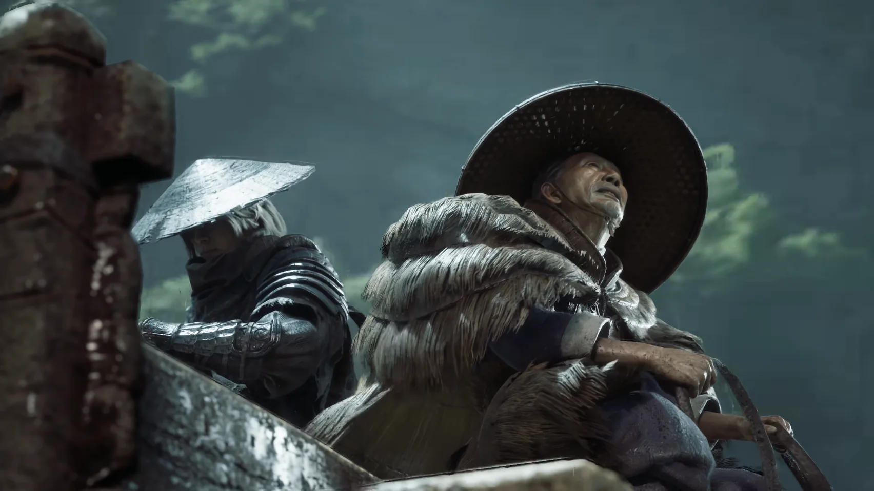 Two figures in wide straw hats sit in a cart; one wears a cape of bundled straw.