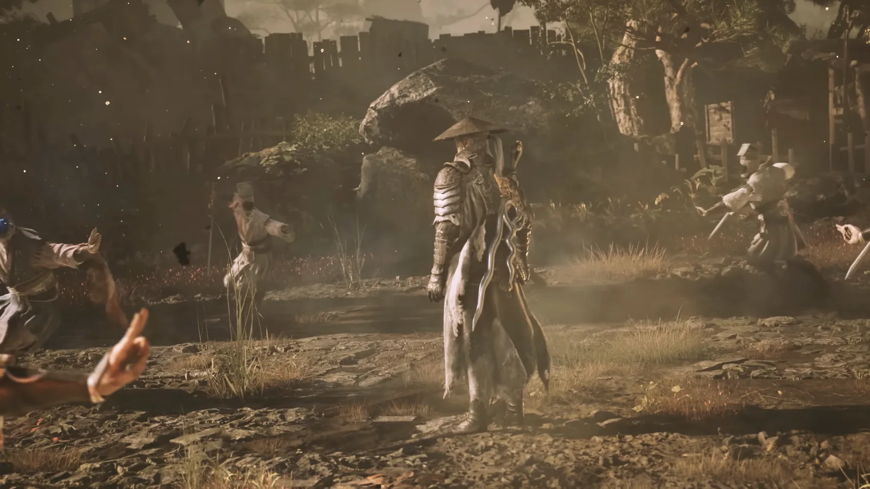 A figure in a straw hat stands in a muddy yard, figures in pale robes with swords spread around it.