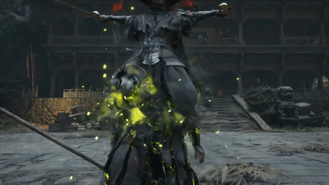 A fighter in a straw hat wrapped in a burst of green light.