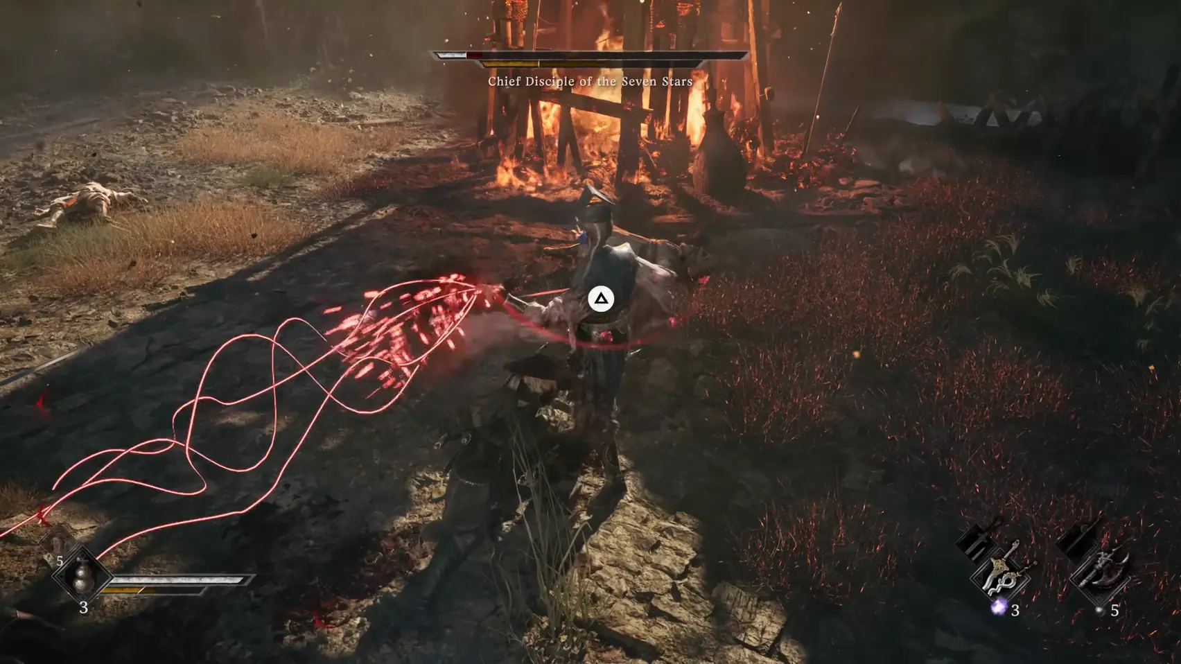 Red threads ribbon across the ground to a swordsman beside a burning tower, a triangle button prompt over him.