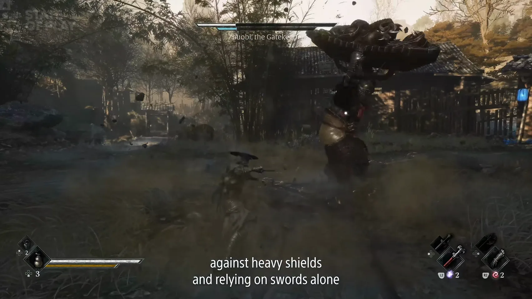 A huge carved shield is raised high over a village yard as dust blows across the ground.