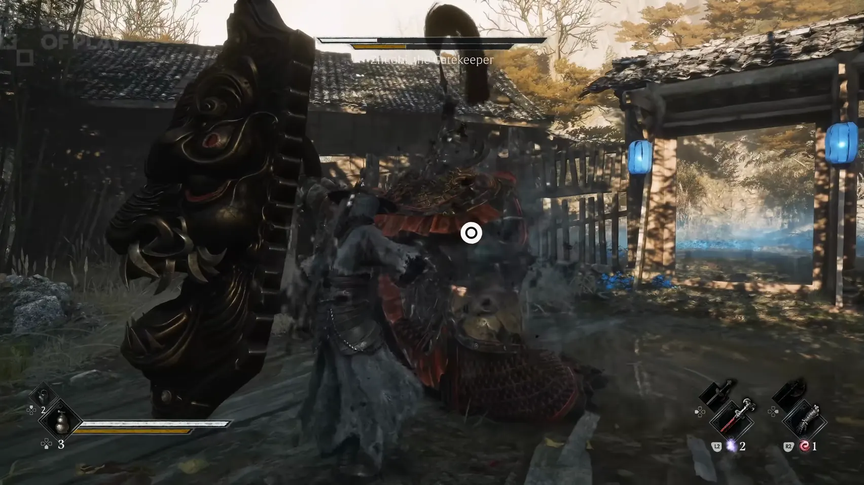A figure stands between a towering carved shield and the armoured body behind it.