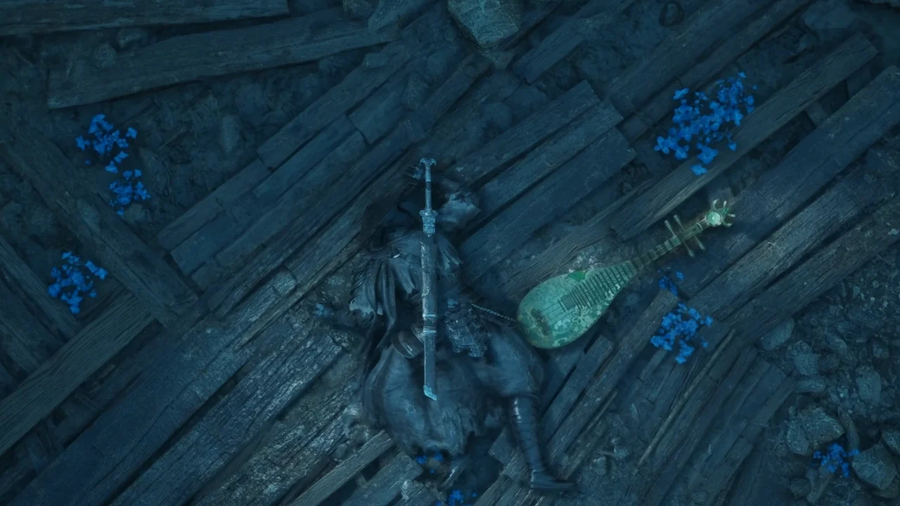 Seen from above, a figure lies still on broken floorboards beside a stringed instrument.